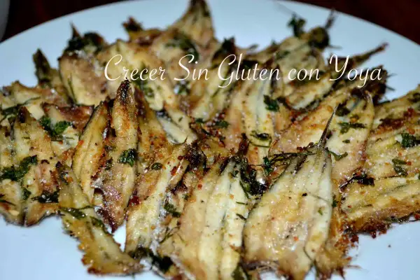 Deliciosos boquerones al horno, crujientes y dorados, con hierbas frescas y un toque de sal. ¡Una receta fácil y sabrosa!